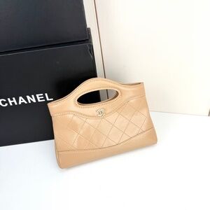CHANEL Tan Quilted Clutch